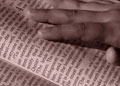 touch hand on book