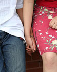 Lesbian Couple sitting holding hands
