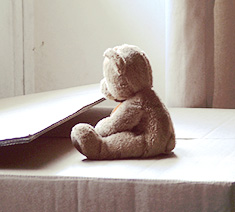  - loneliness -- teddy bear sitting in paper box