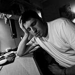 man on desk working late