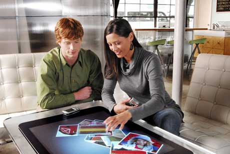 young couple with Microsoft surface computer